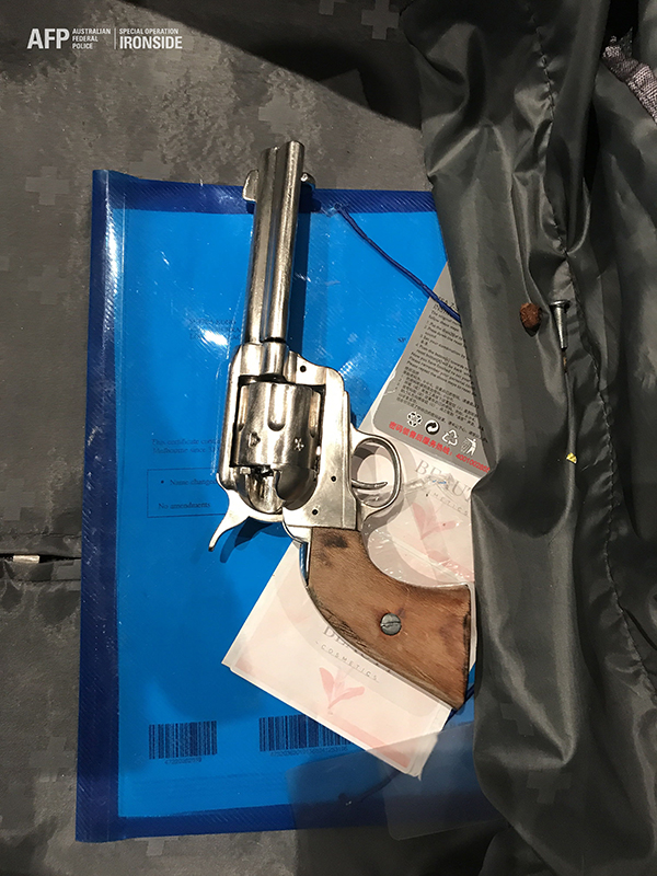 A 33-year-old woman was arrested at the Kangaroo Point property, where police seized a revolver with no serial number